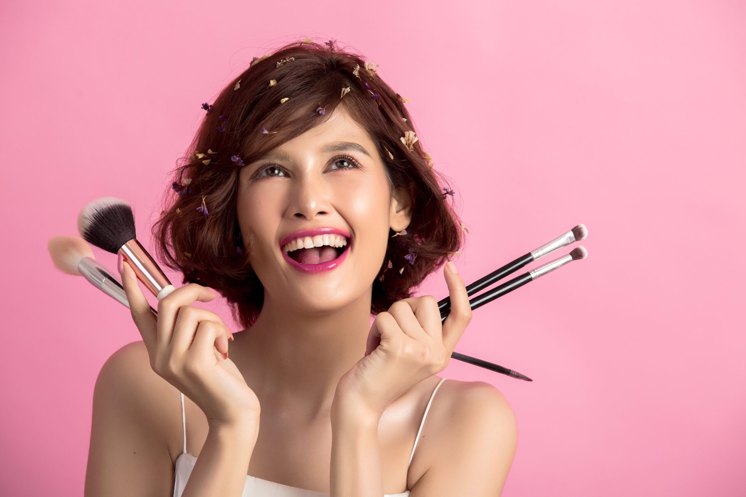 short-hair-asian-young-beautiful-woman-applying-cosmetic-powder-brush-min-scaled.jpg